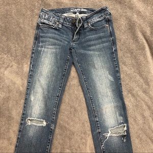 Jeans with holes at knee